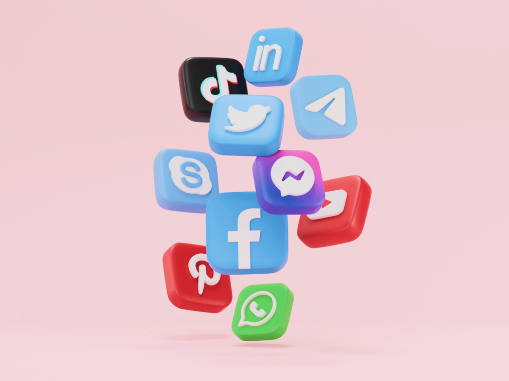 A playful arrangement of social media icons, including Instagram, Twitter, LinkedIn, and others, floating against a soft pink background, symbolising tailored content for diverse platforms