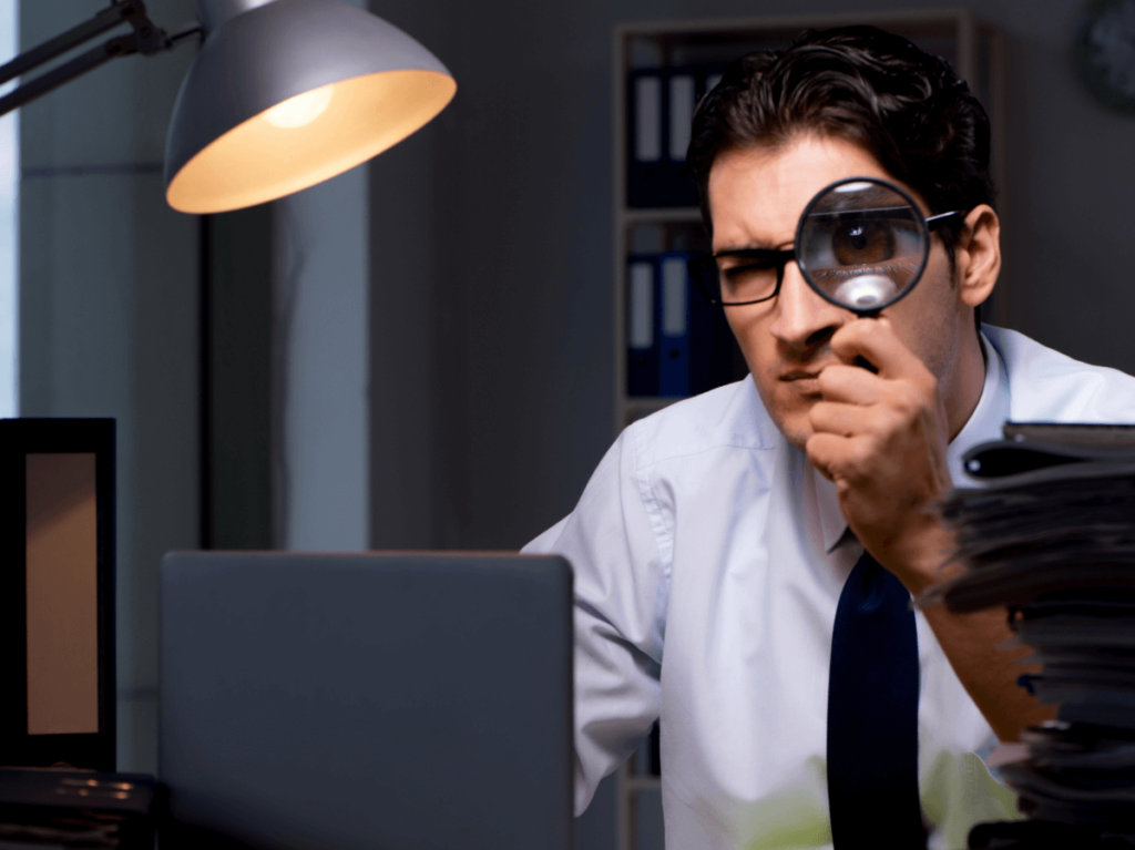 A detective scrutinising a web page through a magnifying glass, representing competitor analysis for SEO