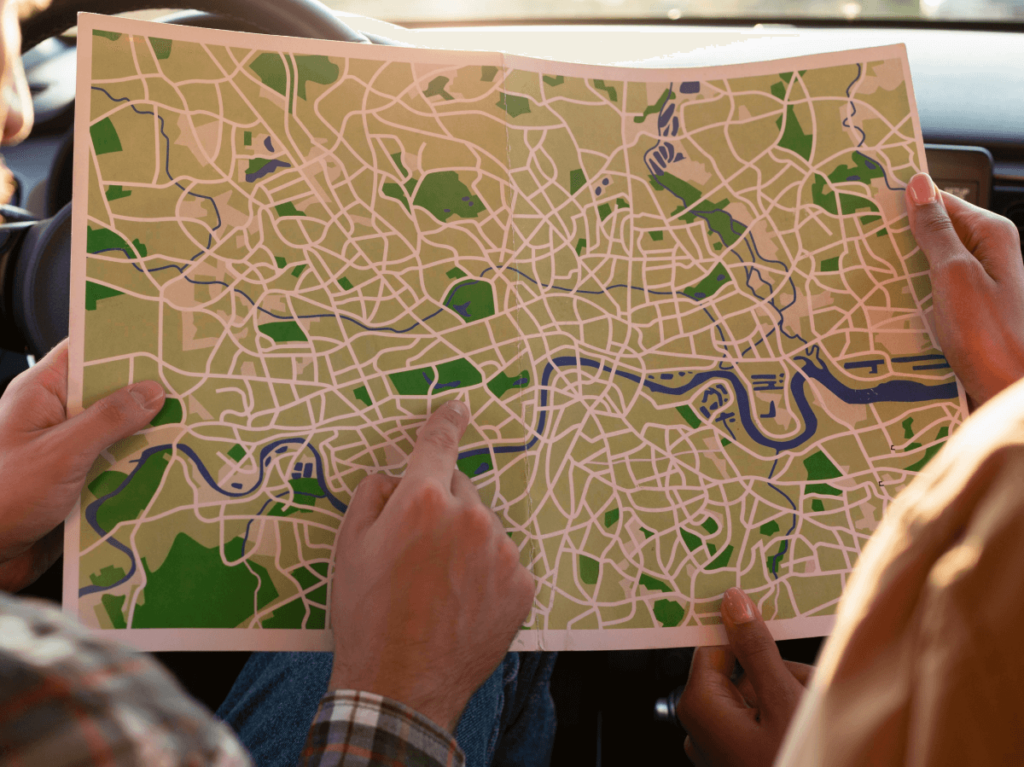 Two people examining a city map, searching for the best route