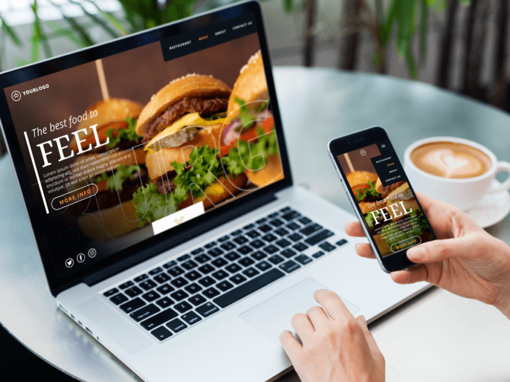 Laptop and mobile phone displaying a restaurant's website with a delicious burger
