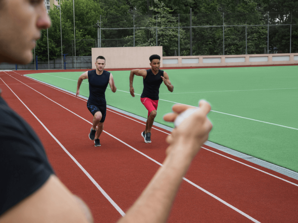 Two athletes sprinting on a track in a race, with a focus on strong competition