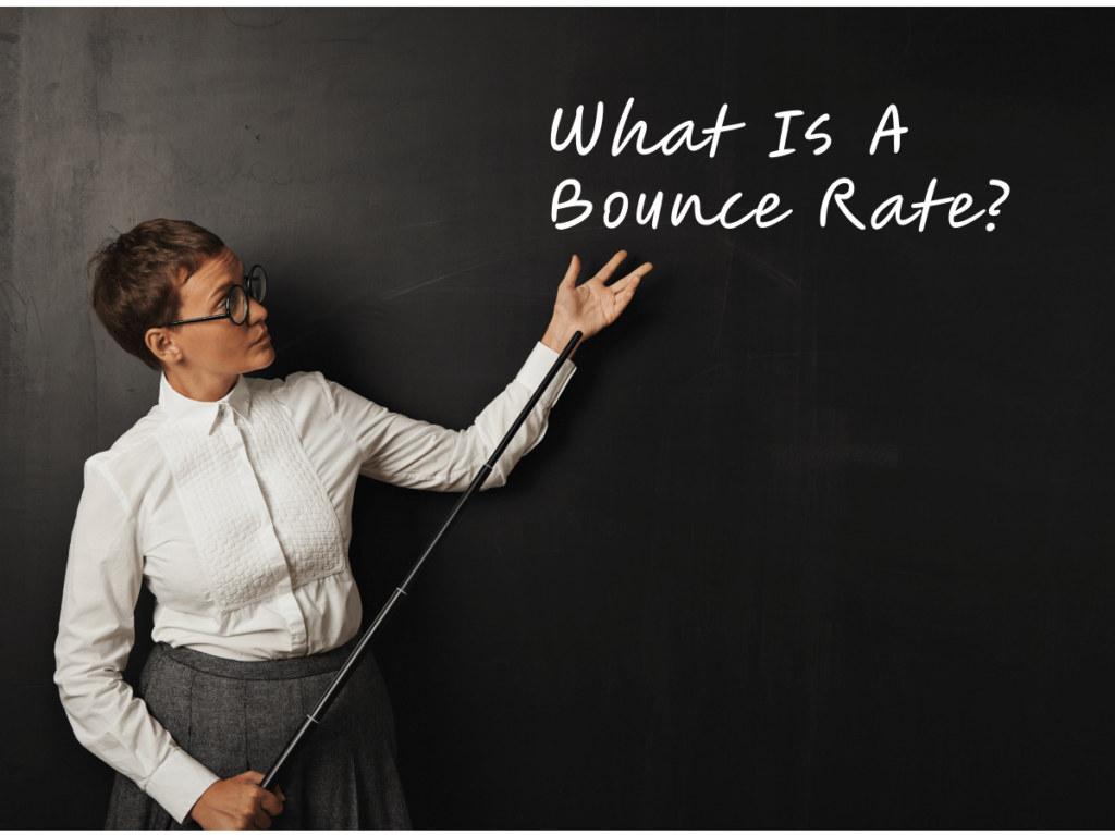A teacher in a classroom points to the phrase 'What Is A Bounce Rate?' written on a blackboard